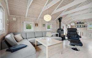 a living room with a couch and a table at Lovely Home In Hemmet With Kitchen in Hemmet