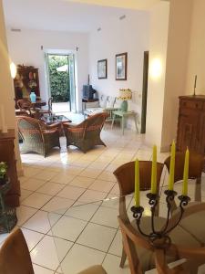 a living room with a table with yellow candles on it at Domus Neroniana - Ingresso privato alla spiaggia. in Anzio