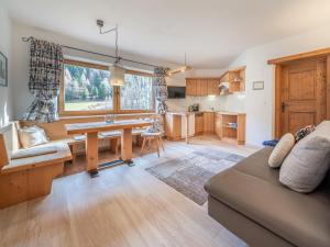 a living room with a couch and a table at Alt Poschach in Obergurgl