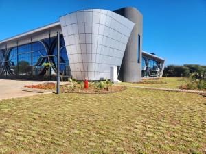 a building with a red fire hydrant in front of it at Cresta Grande Jwaneng in Jwaneng