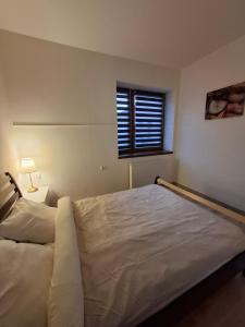 Ένα ή περισσότερα κρεβάτια σε δωμάτιο στο Apartament Maja 2