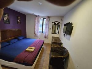 Postel nebo postele na pokoji v ubytování HOTEL Rampai Rooms