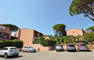 a group of cars parked in a parking lot at Amazing Apartment In Sainte-Maxime in Sainte-Maxime +13 photos