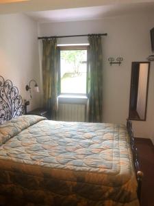 Posteľ alebo postele v izbe v ubytovaní Hotel Bucaneve