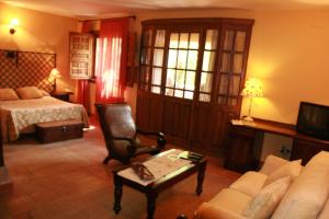 Postel nebo postele na pokoji v ubytování Hotel Posada Molino del Cubo