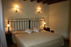 Postel nebo postele na pokoji v ubytování Hotel Posada Molino del Cubo