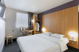 Postel nebo postele na pokoji v ubytování B&B HOTEL Béziers