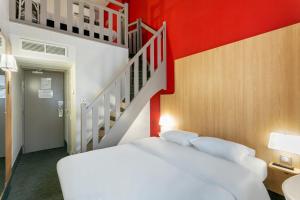 Postel nebo postele na pokoji v ubytování B&B HOTEL Béziers