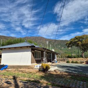 a small house in the middle of a field at Dara House Private Pension in Pidong-ni +13 photos