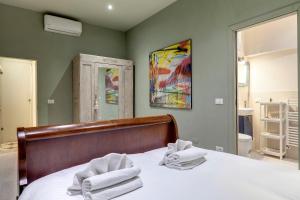 Ένα ή περισσότερα κρεβάτια σε δωμάτιο στο Orto Apartment by Mamo Florence