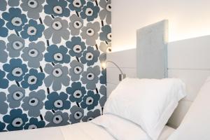 A bed or beds in a room at Hotel Majestic