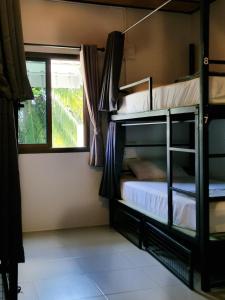 Postel nebo postele na pokoji v ubytování Closca Hostel Koh Tao