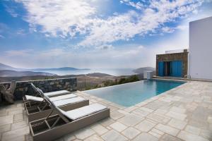 a villa with a swimming pool with a view at Villa Sun in Skiros