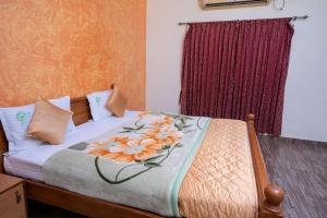 Voodi või voodid majutusasutuse Hotel Misty INN toas