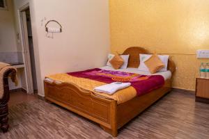 Voodi või voodid majutusasutuse Hotel Misty INN toas