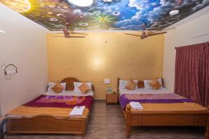 Voodi või voodid majutusasutuse Hotel Misty INN toas
