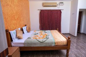 Voodi või voodid majutusasutuse Hotel Misty INN toas