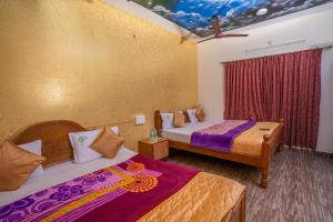 Voodi või voodid majutusasutuse Hotel Misty INN toas