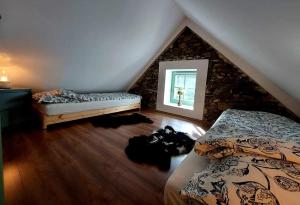 Postel nebo postele na pokoji v ubytování Nálam alszol Vendégház