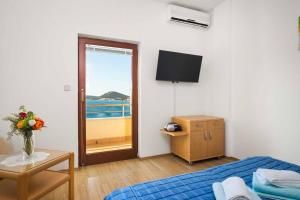 Posteľ alebo postele v izbe v ubytovaní Apartments Kaina
