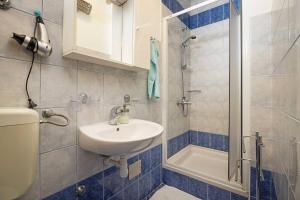 Kúpeľňa v ubytovaní Apartments Kaina