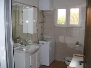 Kúpeľňa v ubytovaní Apartments Ivo + 14 fotografií