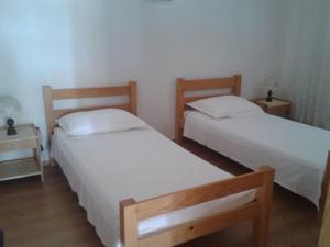 Posteľ alebo postele v izbe v ubytovaní Apartments Ivo