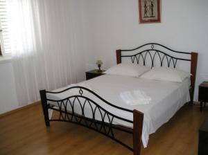 Posteľ alebo postele v izbe v ubytovaní Apartments Ivo