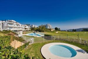 an image of a swimming pool at a resort at Appartement du Bonheur - La Cala Resort in Mijas Costa