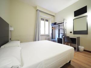Voodi või voodid majutusasutuse Hotel Osimar toas