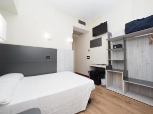 Voodi või voodid majutusasutuse Hotel Osimar toas