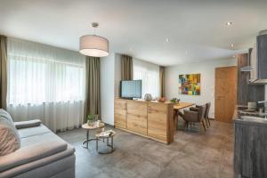 TV a/nebo společenská místnost v ubytování Natur & Familienhotel Der Stieglerhof