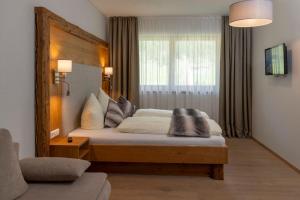 Postel nebo postele na pokoji v ubytování Natur & Familienhotel Der Stieglerhof