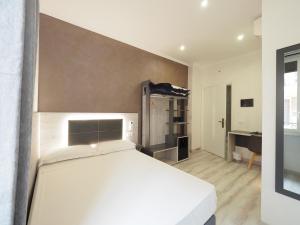 Voodi või voodid majutusasutuse Hotel Osimar toas