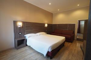 Voodi või voodid majutusasutuse Hotel Osimar toas