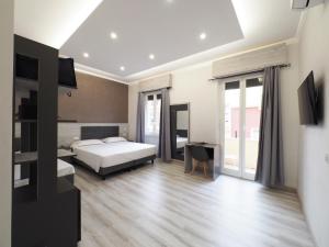 Voodi või voodid majutusasutuse Hotel Osimar toas