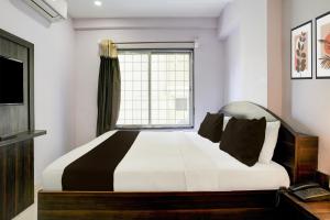 Postel nebo postele na pokoji v ubytování Super Hotel O Chhatrapati Nagar