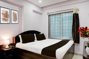 Postel nebo postele na pokoji v ubytování Super Hotel O Chhatrapati Nagar