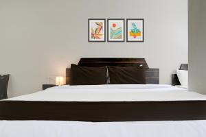Postel nebo postele na pokoji v ubytování Super Hotel O Chhatrapati Nagar