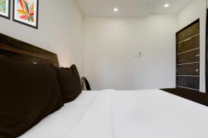 Postel nebo postele na pokoji v ubytování Super Hotel O Chhatrapati Nagar