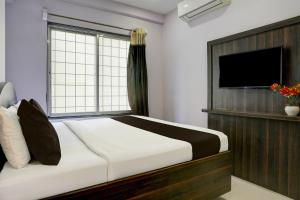 Postel nebo postele na pokoji v ubytování Super Hotel O Chhatrapati Nagar
