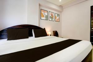 Postel nebo postele na pokoji v ubytování Super Hotel O Chhatrapati Nagar