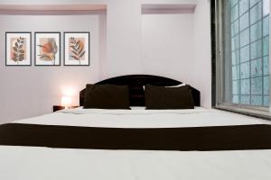 Postel nebo postele na pokoji v ubytování Super Hotel O Chhatrapati Nagar