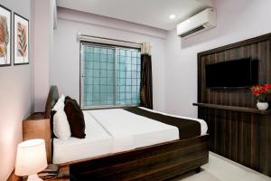 Postel nebo postele na pokoji v ubytování Super Hotel O Chhatrapati Nagar