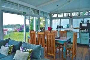 a kitchen and dining room with a table and chairs at Boutique Villa on the Rocks with Stunning Sea Views, Infinity Pool & Private Sea in Trou dʼ Eau Douce