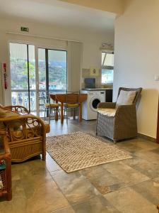 a living room with a couch and a table at Vivenda Linda Vista in Porto da Cruz