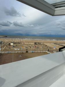 a view of a horse field from a window at Les Embruns in Trouville-sur-Mer