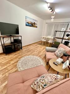 TV a/nebo společenská místnost v ubytování Cosy Flat