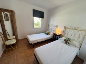 A bed or beds in a room at Daro 3D 46