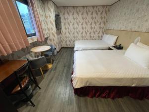 Letto o letti in una camera di Sofu Hotel